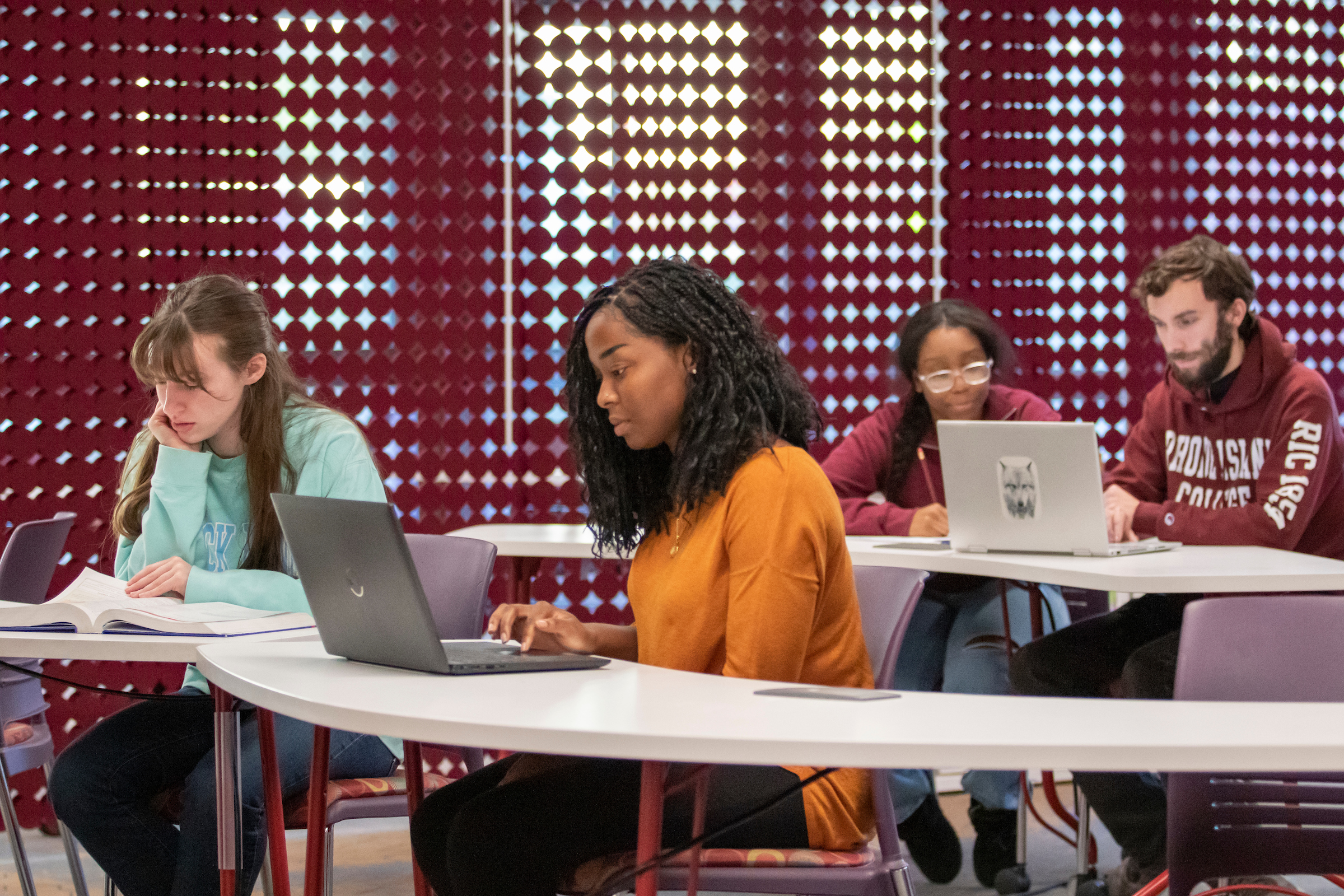 Students and mentors in the Academic Success Center located in Adams Library lower level.